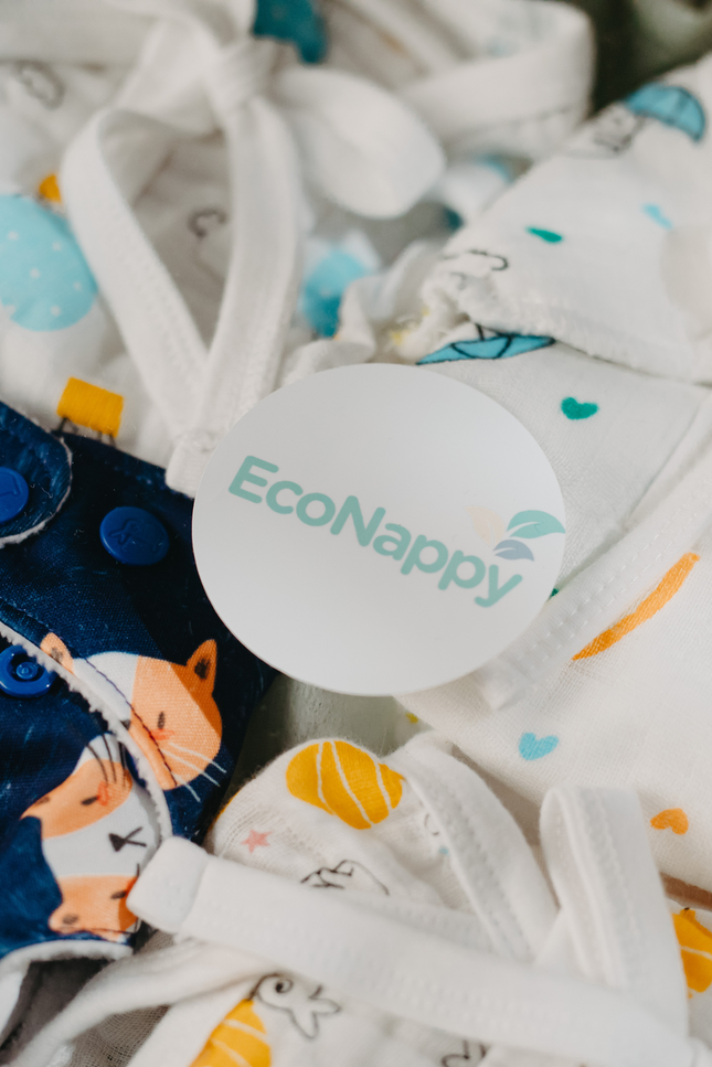 EcoNappy All-Day Essentials Pack diaper for active babies, featuring breathable muslin nappies, organic cotton cloth diaper with superior absorbency, and soft padded options for everyday use, naps, and outings. Eco-friendly, reusable, and comfortable. Diapers. Nappy, muslin clothes, briefs. 