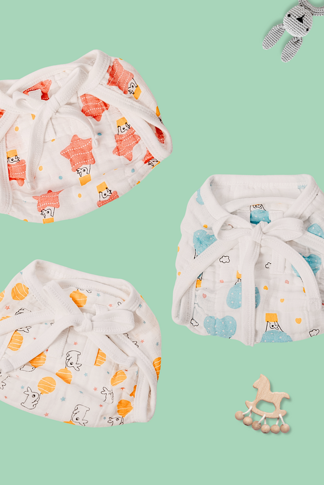 Soft and breathable reusable muslin diaper for newborns, featuring gentle pastel prints. Perfect for diaper-free time, eco-friendly, and designed to protect delicate baby skin. Eco friendly baby clothing. Organic nappies. Baby bummies, pull ups.