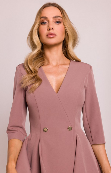 Close-up of the dress’s deep v-neck and smooth textured fabric, showing elegant and structured tailoring.
