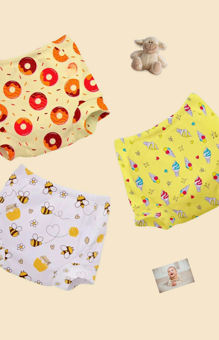 Eco-friendly potty training underwear for toddlers featuring adorable prints like donuts, bees, and ice creams. diapers, breathable, and leak-proof, perfect for hassle-free toilet training. Comfortable & ensures all-day comfort for active toddlers.