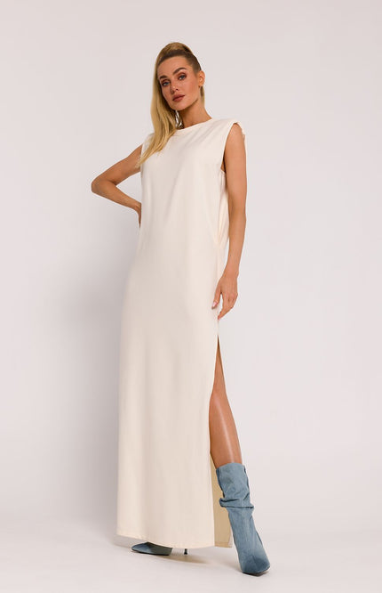 Elegant sleeveless maxi knit dress with shoulder pads and a side slit, designed for a modern and effortless look. Featuring a relaxed fit, soft fabric, and a minimalist silhouette, perfect for both casual and formal occasions.