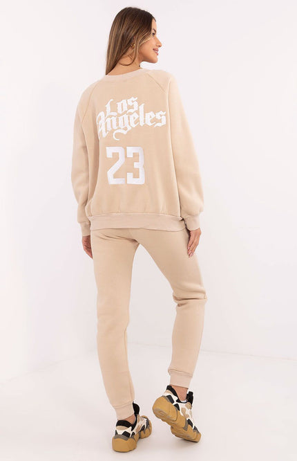 Back view of beige women’s tracksuit featuring “Los Angeles” embroidery and number 23