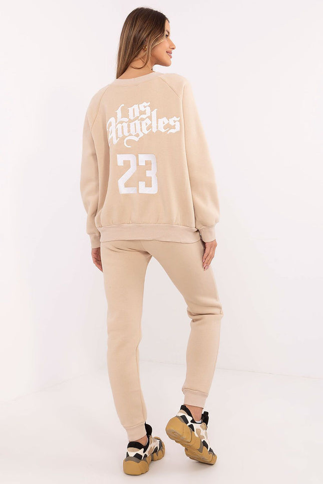 Back view of beige women’s tracksuit featuring “Los Angeles” embroidery and number 23