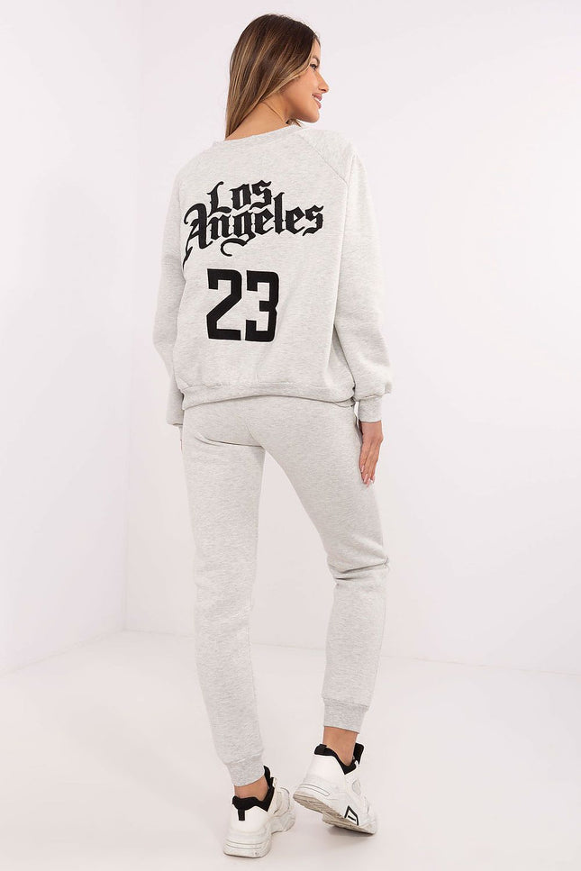 Back view of light grey tracksuit featuring “Los Angeles” embroidery and high-waisted joggers