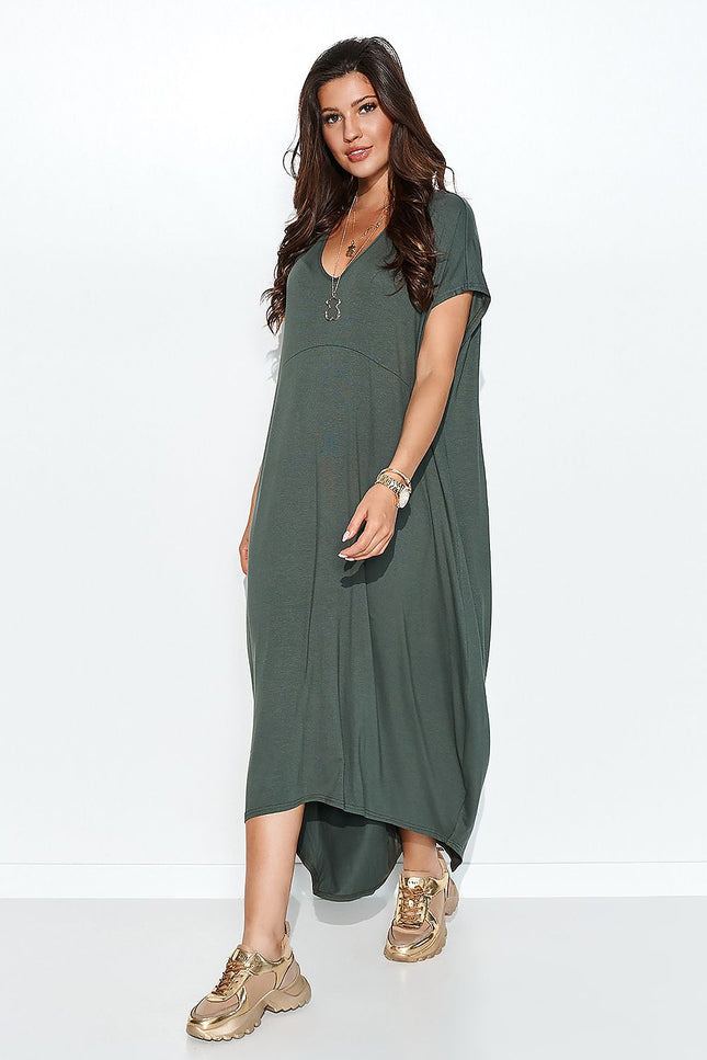 Woman modeling a flowy, asymmetrical daydress from MÏLOT, made from airy viscose in a relaxed fit, available in multiple colors including sage green, featuring short sleeves and a comfortable, minimalist style.