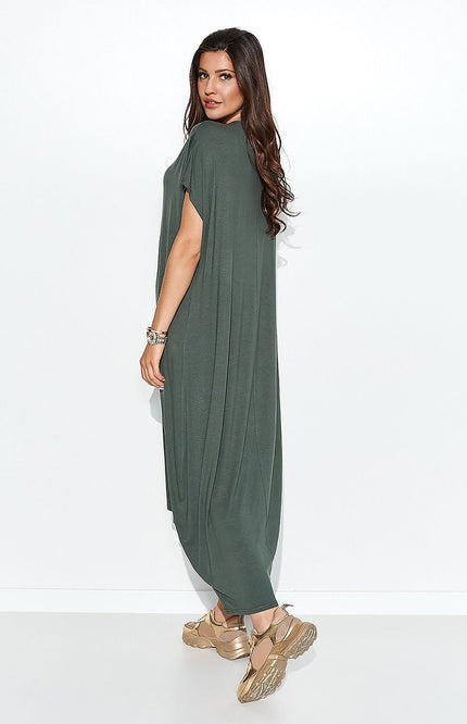 Woman modeling a flowy, asymmetrical daydress from MÏLOT, made from airy viscose in a relaxed fit, available in multiple colors including sage green, featuring short sleeves and a comfortable, minimalist style.