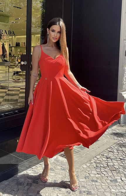 Elegant red midi dress in a soft viscose blend, ideal for warm-weather occasions.