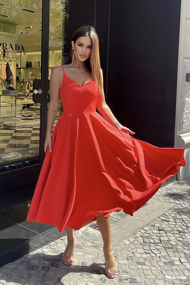 Elegant red midi dress in a soft viscose blend, ideal for warm-weather occasions.