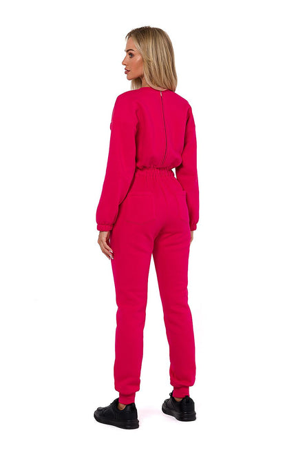 Back view of pink jumpsuit – minimalist design with tapered legs